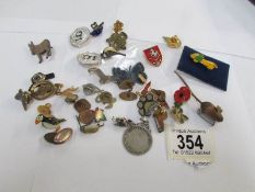 A mixed lot of badges and cuff links