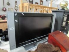 A Philips flat screen television with remote control