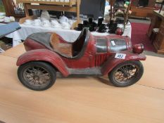 A large scale model of a vintage car