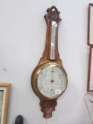 An Edwardian oak aneroid barometer