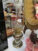 An electrified brass oil lamp,