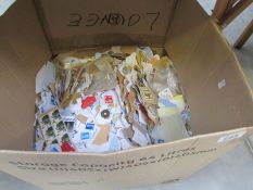 A large box of loose postage stamps