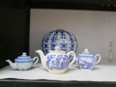 3 blue and white teapots and a large blue and white pumpkin pot