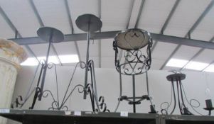 3 Wrought iron stands and a ceiling light