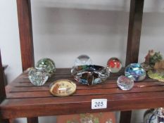 A quantity of glass paperweights and a glass bowl