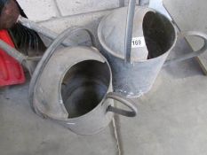 2 galvanised watering cans