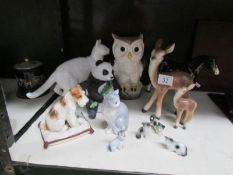 A mixed lot of animal figures including owl, panda, horse,