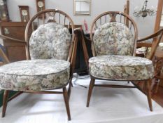 A pair of Ercol style fireside chairs