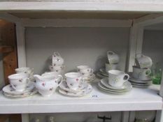 A shelf of tea ware