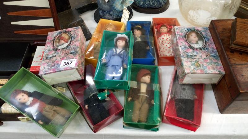 10 small boxed dolls