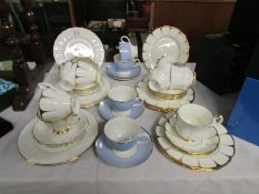 An 18 piece and a 16 piece gold decorated tea sets together with 4 cups and saucers