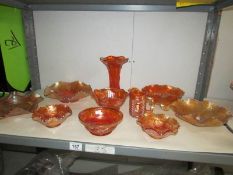 A shelf of carnival glass