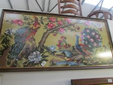 A framed and glazed tapestry