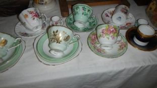 A quantity of assorted tea cups and saucers