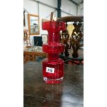 A red glass vase