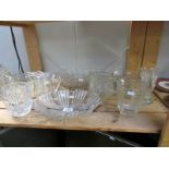 A shelf of glass ware