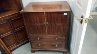 A mahogany inlaid commode