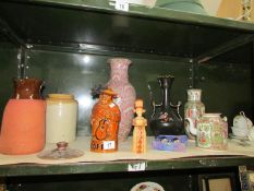 A shelf of miscellaneous including oriental