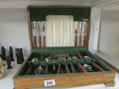 A cutlery box and contents