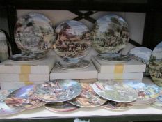 A shelf of collector's plates