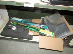 A shelf of miscellaneous including windscreen wipers,