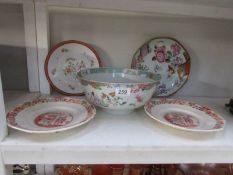 An oriental bowl and 4 plates