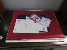 A collection of Red Arrows memorabilia including calendar,