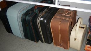 5 suitcases and a vanity case