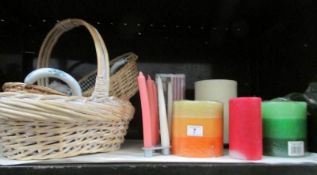 A shelf of baskets and candles