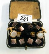 A cased set of cuff links and one other pair