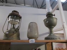 An oil lamp and a tilley lamp