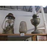 An oil lamp and a tilley lamp