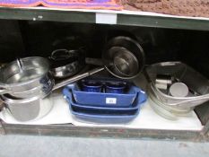 A shelf of kitchen ware