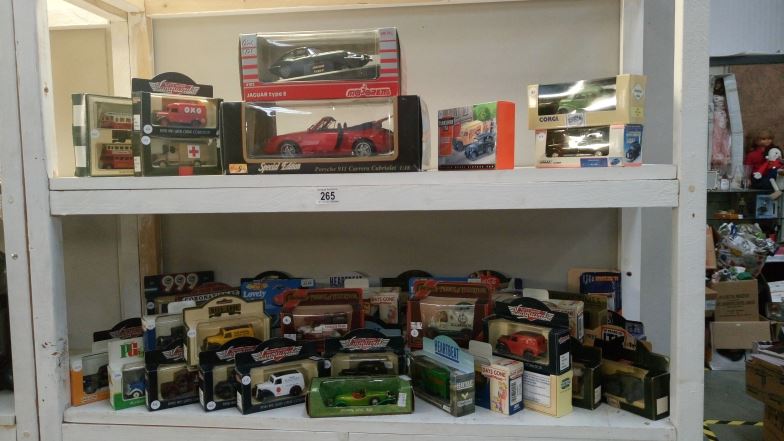 In excess of 60 boxed model vehicles including Lledo, Majorette,