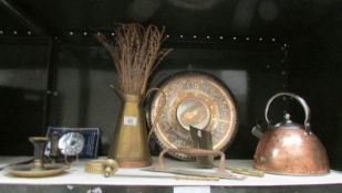 A shelf of brass and copper