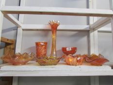 A shelf of carnival glass