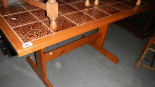 A tiled top dining table