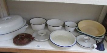 A shelf of enamel ware