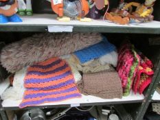 A shelf of crochet items etc