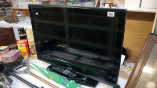 A Finlux flat screen television with remote control