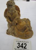 A carved soapstone figure of a lady with parasol,