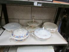 A quantity of tureens and a cake stand