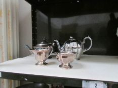 A silver plate teapot and one other teapot etc.