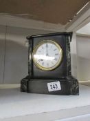 A black marble mantel clock