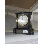 A black marble mantel clock