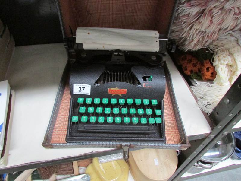 A Vintage Lilliput typewriter in case