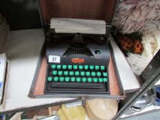 A Vintage Lilliput typewriter in case