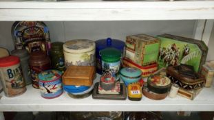 A shelf of old tins etc