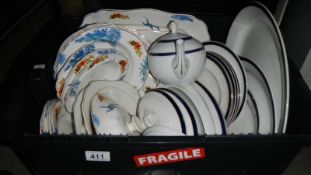 A box of assorted dinner ware