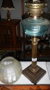 A Victorian oil lamp with Paladian column,